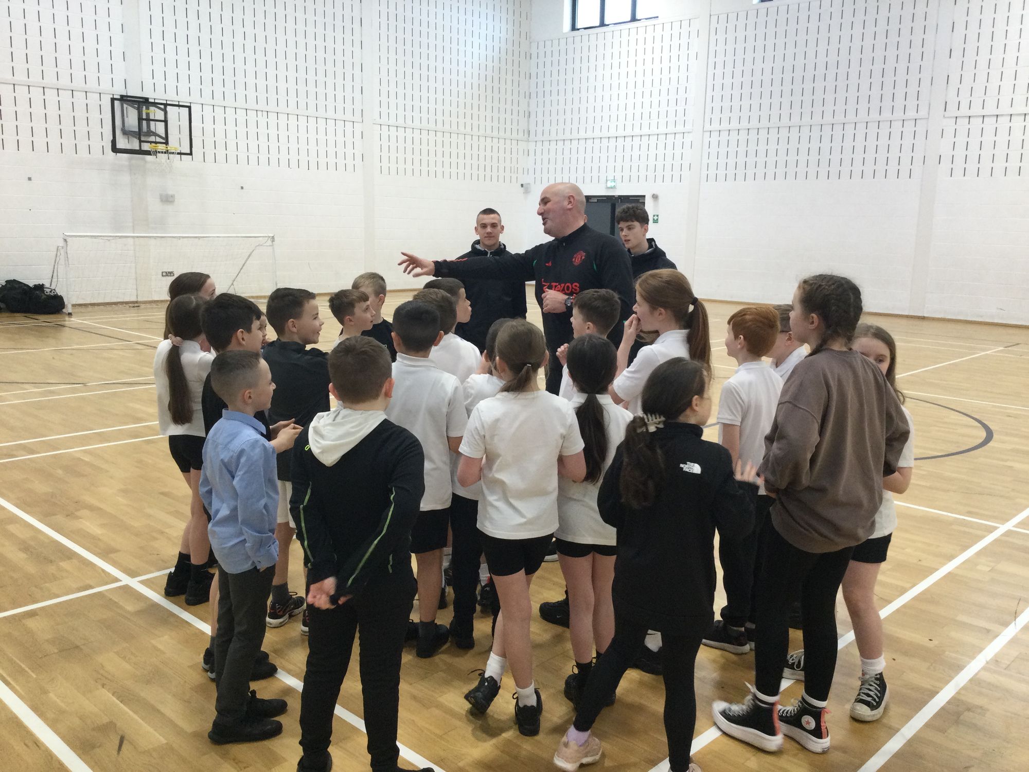 Year 5 pupils participate in PE sessions with the Manchester United Foundation.