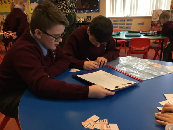 Year 4 & 7 boys collecting money for the Fairtrade raffle on Friday