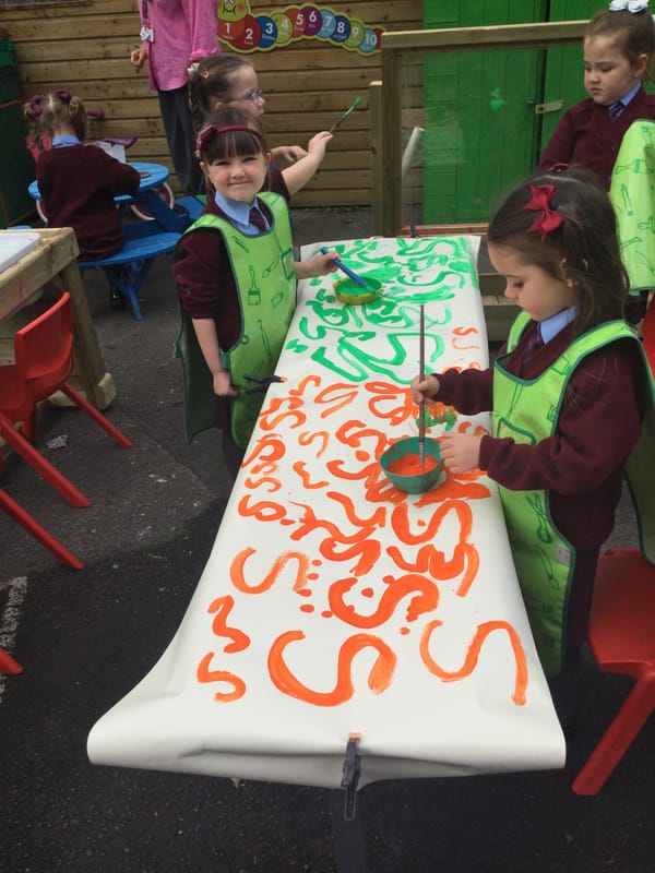 Year 1a enjoying playing ,sorting and practising writing the letter s in our Outdoor Classroom.