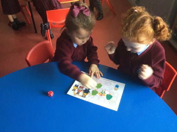 Learning to take turns in Year 1a.